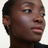 Wonderblush-La Laque Tinted Lip Oil-Makeup-LaLaque-ModelDarkSkin-Geranium-The Detox Market | Geranium - Bright rosy pink