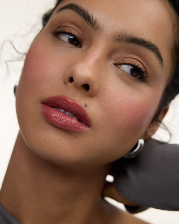 Wonderblush-Le Baume Tinted Lip Balm-Makeup-LeBaume-ModelMediumSkin-Petale_ad06ad88-2537-4ee2-9c65-53b407340394-The Detox Market | 